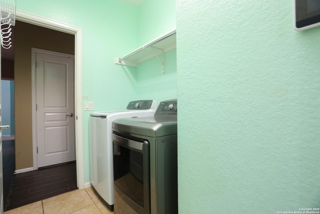 3410 Port Pl, San Antonio, TX 78253 - laundry area with washer and clothes dryer and light tile patterned floors