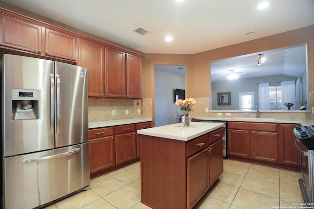 3410 Port Pl, San Antonio, TX 78253 - kitchen with stainless steel appliances, a sink, decorative backsplash, light countertops, and recessed lighting