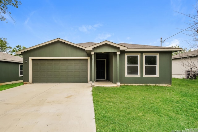 2434 Bermuda, San Antonio, TX 78222 - ranch-style house with a garage, driveway, and a front lawn