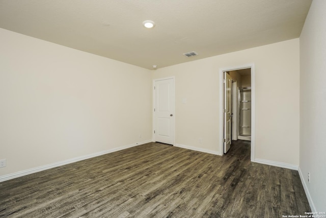 2434 Bermuda, San Antonio, TX 78222 - unfurnished room with dark wood-style floors and baseboards