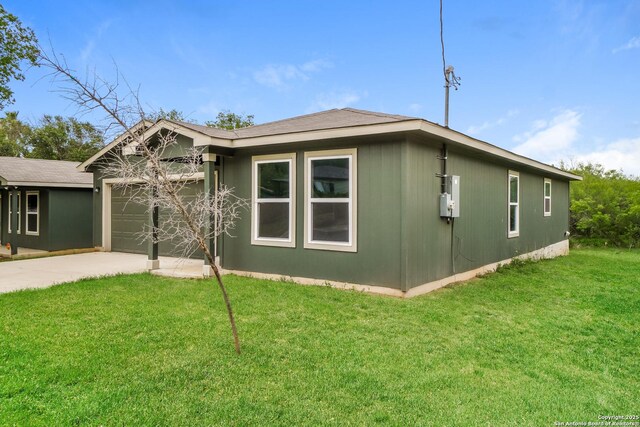 2434 Bermuda, San Antonio, TX 78222 - view of property exterior with a garage, driveway, and a lawn