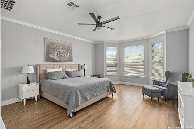 24719 Alamosa Fls, San Antonio, TX 78255 - bedroom featuring multiple windows, light wood-type flooring, ornamental molding, and baseboards