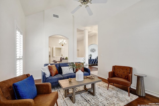 67 Oakwell Farms, San Antonio, TX 78218 - living room featuring arched walkways, high vaulted ceiling, a ceiling fan, a chandelier, and baseboards