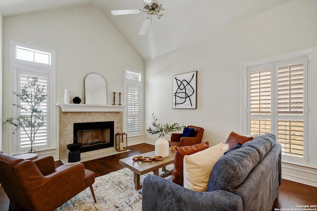 67 Oakwell Farms, San Antonio, TX 78218 - living room with wood finished floors, high vaulted ceiling, a tile fireplace, and ceiling fan