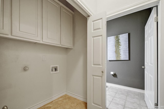 67 Oakwell Farms, San Antonio, TX 78218 - laundry room featuring cabinet space, washer hookup, baseboards, and light tile patterned floors