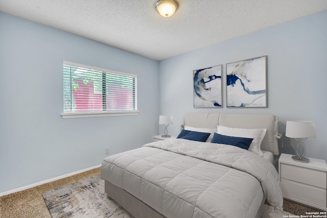 11202 Candle Park, San Antonio, TX 78249 - carpeted bedroom with a textured ceiling and baseboards