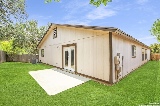11202 Candle Park, San Antonio, TX 78249 - back of house with central air condition unit, french doors, and a patio area