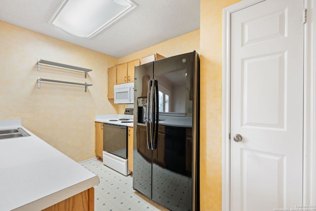 6826 Evercrest, San Antonio, TX 78239 - kitchen with white appliances, light floors, and light countertops