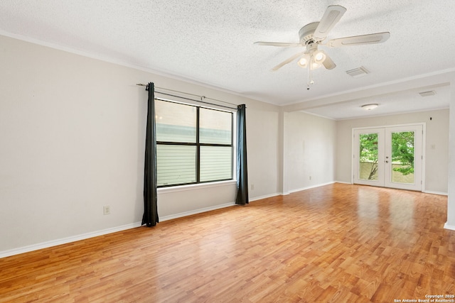 6826 Evercrest, San Antonio, TX 78239 - unfurnished room featuring a textured ceiling, light wood-type flooring, ceiling fan, baseboards, and ornamental molding