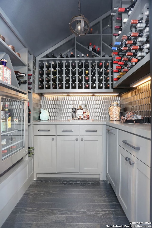 8306 Country Side, San Antonio, TX 78209 - wine cellar with dark wood-type flooring and beverage cooler