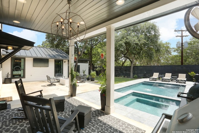 8306 Country Side, San Antonio, TX 78209 - view of swimming pool featuring an in-ground hot tub, a fenced backyard, a patio area, and an outdoor structure