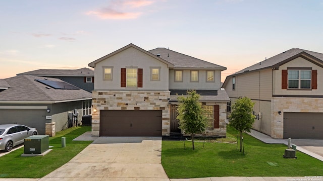 12942 Irvin Path, San Antonio, TX 78254 - view of front of property with stone siding, a garage, driveway, and a front yard