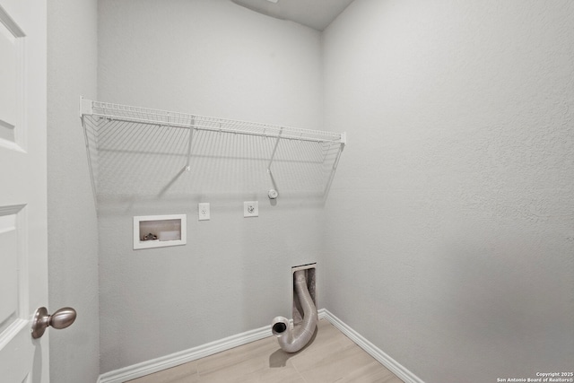 12942 Irvin Path, San Antonio, TX 78254 - washroom featuring electric dryer hookup, washer hookup, baseboards, gas dryer hookup, and light wood-style floors