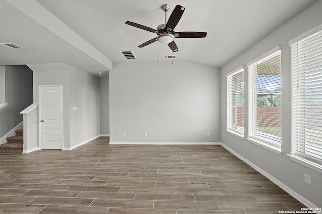 12942 Irvin Path, San Antonio, TX 78254 - unfurnished room with wood finished floors, a ceiling fan, stairway, lofted ceiling, and baseboards
