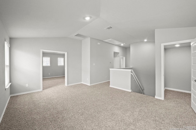 12942 Irvin Path, San Antonio, TX 78254 - empty room with carpet flooring, recessed lighting, vaulted ceiling, and baseboards