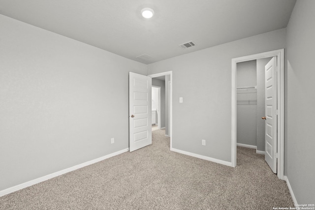 12942 Irvin Path, San Antonio, TX 78254 - unfurnished bedroom featuring carpet flooring, a spacious closet, baseboards, and a closet