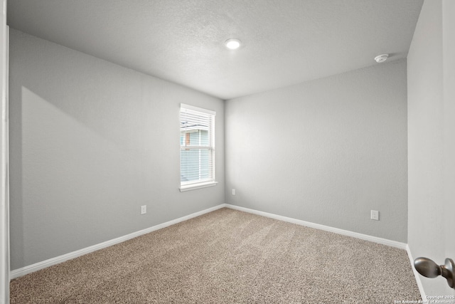 12942 Irvin Path, San Antonio, TX 78254 - carpeted spare room with baseboards and a smoke detector