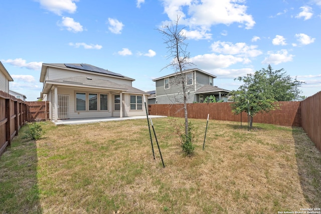 12942 Irvin Path, San Antonio, TX 78254 - back of house with solar panels and a patio
