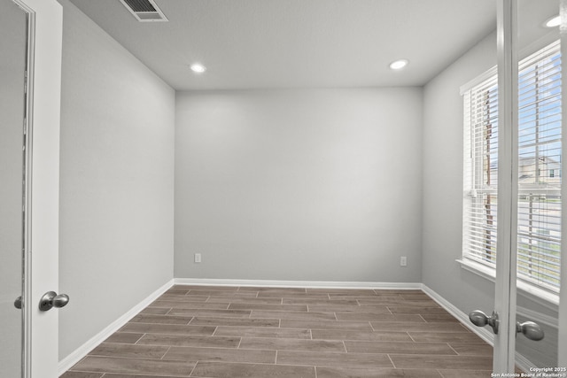 12942 Irvin Path, San Antonio, TX 78254 - empty room with wood finished floors, baseboards, and recessed lighting