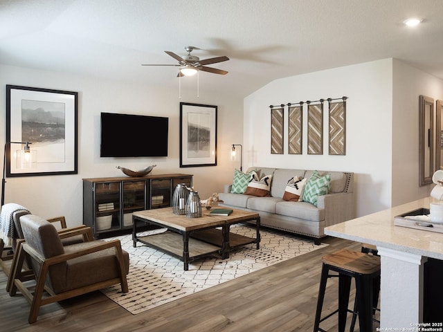 204 Dakota Rdg, Cibolo, TX 78108 - living room featuring a ceiling fan, light wood finished floors, and vaulted ceiling