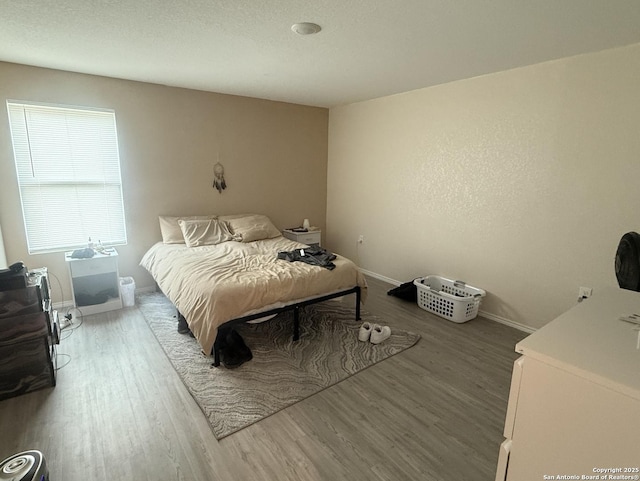 4543 Zoe Pass, San Antonio, TX 78222 - bedroom with wood finished floors and baseboards