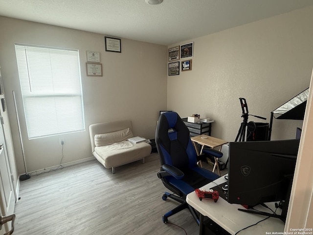 4543 Zoe Pass, San Antonio, TX 78222 - office area featuring wood finished floors, a textured ceiling, and baseboards