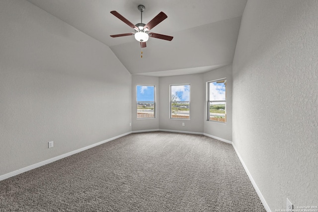 6228 Persimmon Lk, San Antonio, TX 78254 - empty room featuring a textured wall, lofted ceiling, ceiling fan, carpet floors, and baseboards