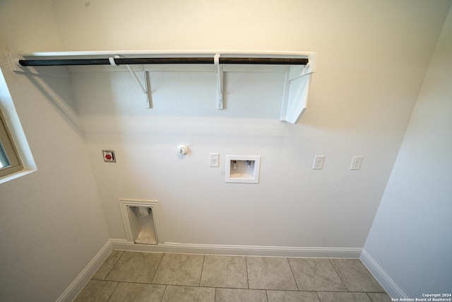 5721 Provo Pl, San Antonio, TX 78263 - laundry area featuring hookup for a gas dryer, hookup for a washing machine, baseboards, and light tile patterned floors