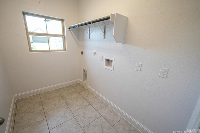 5721 Provo Pl, San Antonio, TX 78263 - washroom with gas dryer hookup, electric dryer hookup, light tile patterned flooring, and washer hookup