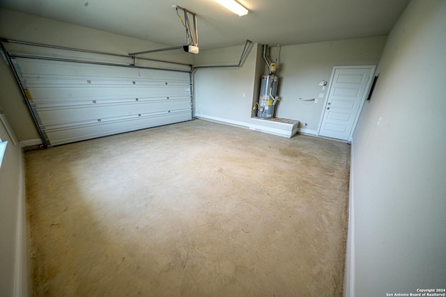 5721 Provo Pl, San Antonio, TX 78263 - garage featuring gas water heater and a garage door opener