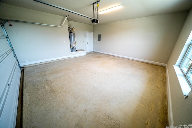 5721 Provo Pl, San Antonio, TX 78263 - garage with gas water heater, a garage door opener, electric panel, and baseboards
