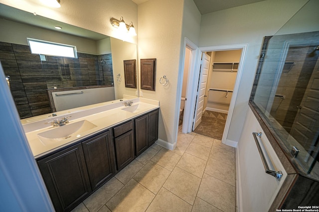 5721 Provo Pl, San Antonio, TX 78263 - bathroom featuring tiled shower, double vanity, toilet, and a walk in closet