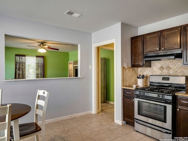126 Arnold, San Antonio, TX 78213 - kitchen with gas range, under cabinet range hood, dark brown cabinets, tasteful backsplash, and a ceiling fan