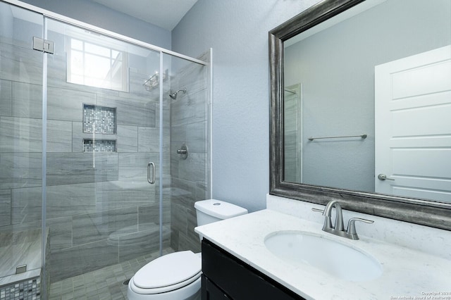24342 Mateo Rdg, San Antonio, TX 78261 - full bath with toilet, vanity, a stall shower, and a textured wall