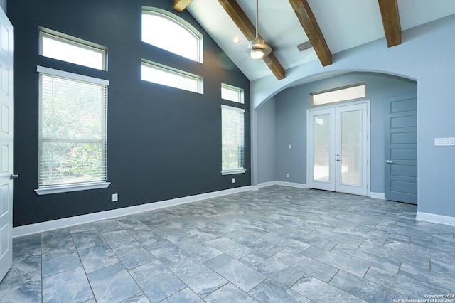 24342 Mateo Rdg, San Antonio, TX 78261 - spare room with arched walkways, beamed ceiling, healthy amount of natural light, french doors, and baseboards