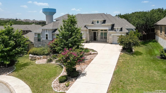 24342 Mateo Rdg, San Antonio, TX 78261 - view of front facade featuring stone siding, a shingled roof, driveway, and a front lawn