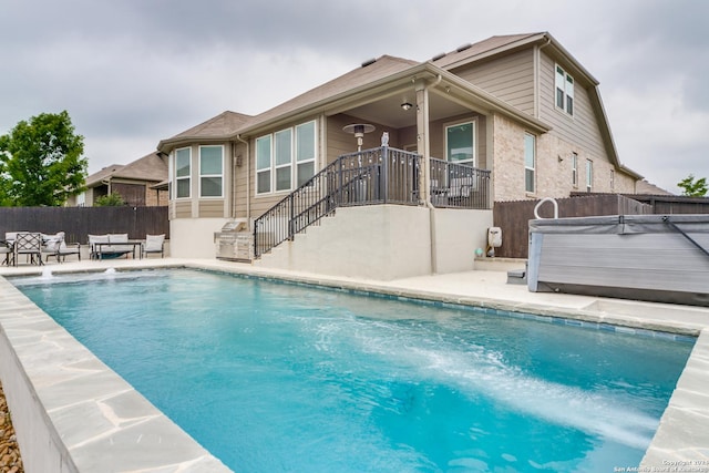 7604 Pecos Rdg, Boerne, TX 78015 - view of pool featuring a hot tub, a fenced backyard, a patio, and an outdoor living space
