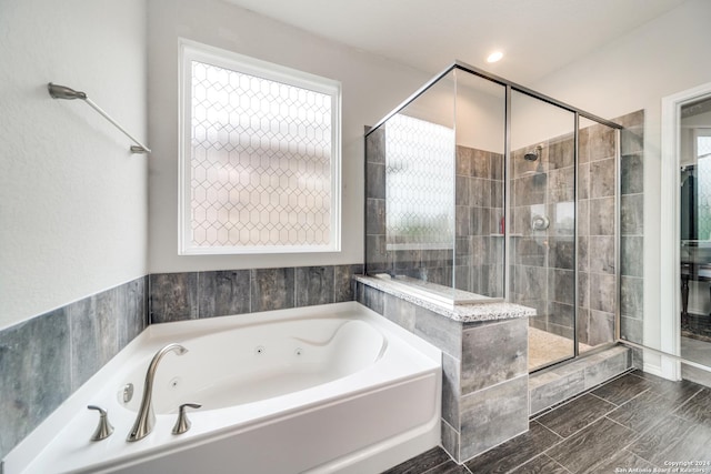 7604 Pecos Rdg, Boerne, TX 78015 - full bath featuring a jetted tub, a stall shower, and plenty of natural light