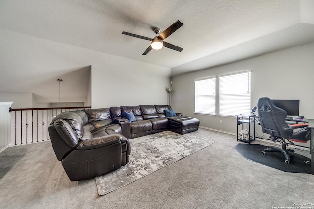 7604 Pecos Rdg, Boerne, TX 78015 - carpeted living room featuring ceiling fan, an office area, vaulted ceiling, baseboards, and a textured ceiling