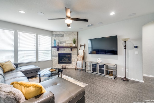 7604 Pecos Rdg, Boerne, TX 78015 - living area featuring ceiling fan, baseboards, wood finished floors, a stone fireplace, and recessed lighting