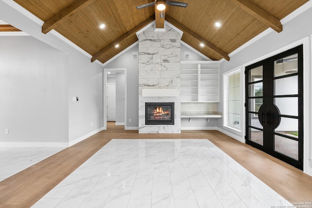 3828 Palomino Spgs, Bandera, TX 78003 - unfurnished living room with wooden ceiling, marble finish flooring, a large fireplace, baseboards, and recessed lighting