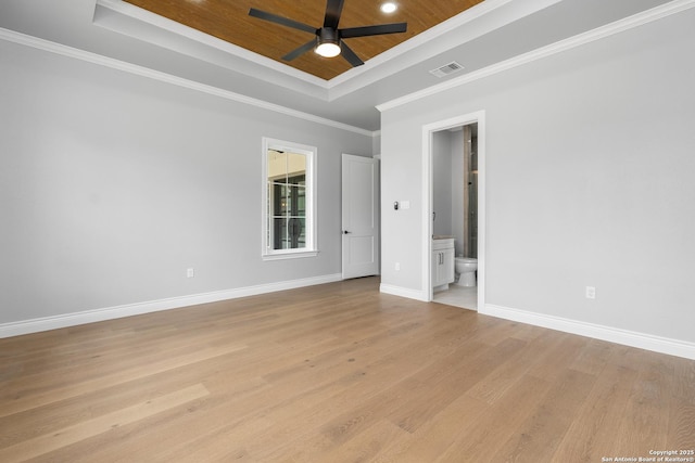 3828 Palomino Spgs, Bandera, TX 78003 - unfurnished room with a raised ceiling, a ceiling fan, light wood-style flooring, baseboards, and ornamental molding
