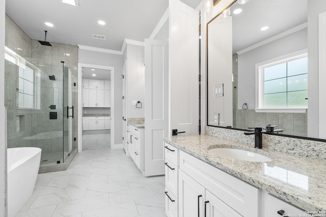 3828 Palomino Spgs, Bandera, TX 78003 - full bathroom with a shower stall, crown molding, marble finish floors, two vanities, and a freestanding tub