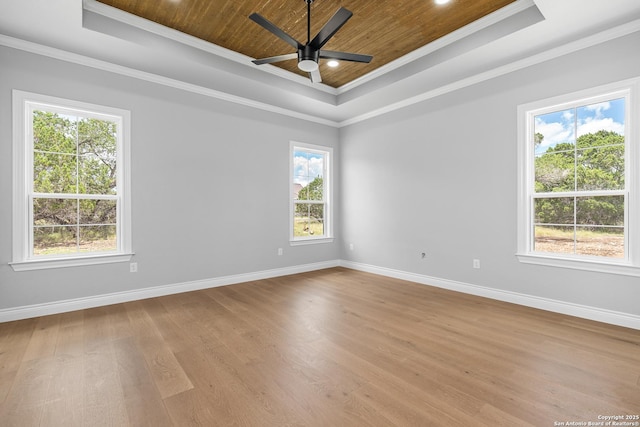 3828 Palomino Spgs, Bandera, TX 78003 - unfurnished room featuring ornamental molding, wood ceiling, a raised ceiling, baseboards, and wood finished floors