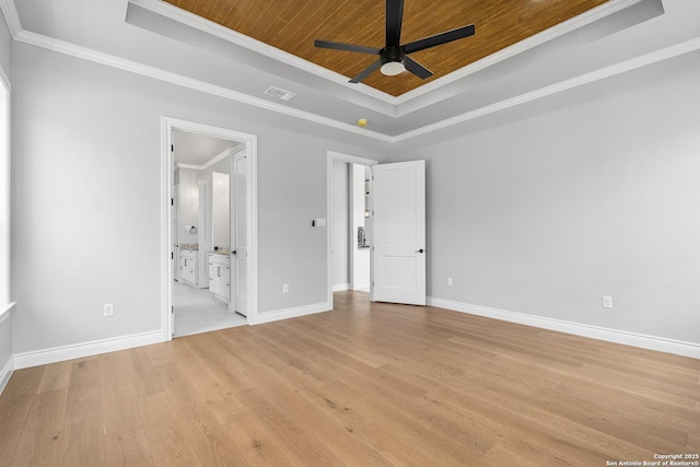 3828 Palomino Spgs, Bandera, TX 78003 - unfurnished bedroom featuring a tray ceiling, ornamental molding, light wood-style flooring, wood ceiling, and baseboards