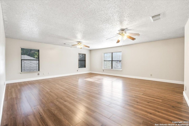 6119 Ferrysage, San Antonio, TX 78244 - unfurnished room with a ceiling fan, a textured ceiling, wood finished floors, and baseboards