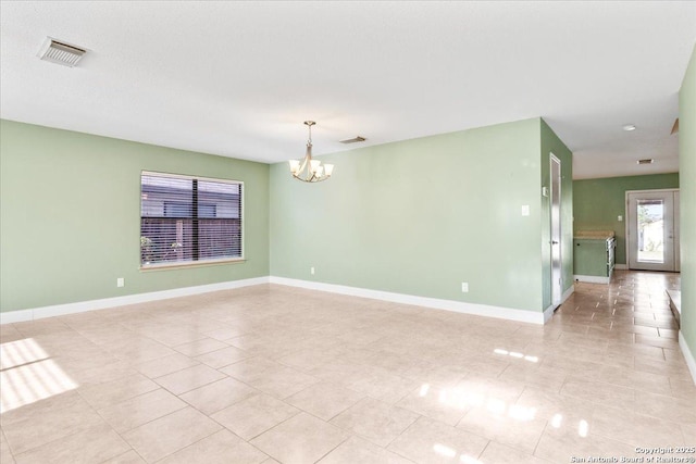 6119 Ferrysage, San Antonio, TX 78244 - unfurnished room with a chandelier, light tile patterned floors, and baseboards