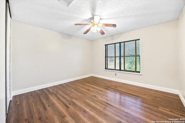 6119 Ferrysage, San Antonio, TX 78244 - unfurnished room with baseboards, wood finished floors, a ceiling fan, and a textured ceiling