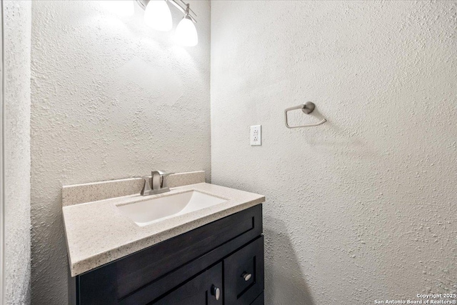 6119 Ferrysage, San Antonio, TX 78244 - bathroom featuring vanity and a textured wall
