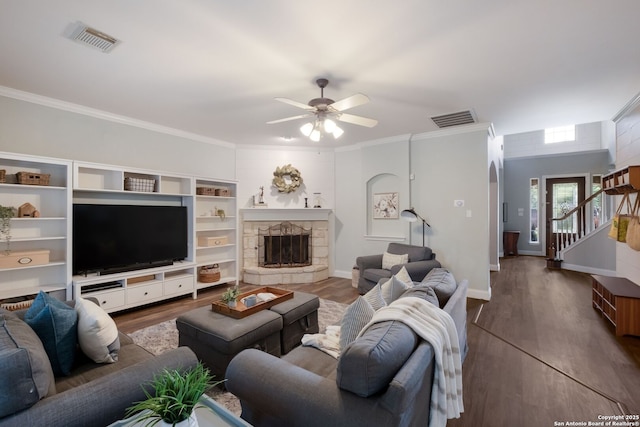 830 Emerald Bay, San Antonio, TX 78260 - living room with dark wood-type flooring, ceiling fan, crown molding, a fireplace, and baseboards